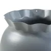 A close-up view of the top edge of a gray vase or pot with a ruffled rim. Produktbild-Vorschau