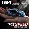 A small blue remote control car is held in a person's hand, with text overlays indicating speed and scale. Podgląd zdjęcia produktu