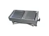 A portable charcoal grill with two cooking surfaces and foldable legs, presented on a white background. Produktbild-Vorschau