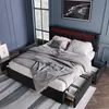 A bedroom scene featuring a bed with storage drawers and a plush blanket.