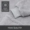 A close-up view of a soft, fluffy grey blanket or hoodie with a grey fabric cuff. A dark grey square overlay contains text and a symbol related to weight. Produktbild-Vorschau