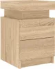 A close-up view of a wooden nightstand with drawers. Náhled obrázku produktu