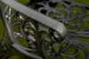 A close-up view of the armrest and decorative scrollwork of a dark gray metal garden chair. Produktbild-Vorschau