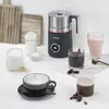 A SEVERIN milk frother is displayed on a white countertop surrounded by various drinks and ingredients. Produktbild-Vorschau