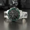 A close-up studio shot of a Maserati men's chronograph watch with a black dial and a green bezel, placed on a dark, reflective surface. Produktbild-Vorschau