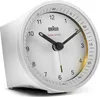A white Braun radio-controlled alarm clock is shown against a white background. Voir les images du produit