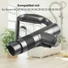A close-up of a vacuum cleaner handle attachment, with a blurred background showing a living room setting with plants and furniture. Produktbild-Vorschau