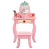 A pink children's vanity table and stool set with a strawberry-themed mirror and accessories. Produktbild-Vorschau