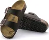 A pair of brown Birkenstock Arizona sandals on a white background. Anteprima dell’immagine prodotto