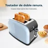 A light blue and silver toaster with two slices of toast in it, placed on a white surface with some baked goods in the background. Produktbild-Vorschau