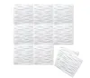 A set of white 3D wall panels with a textured, geometric pattern, arranged in a grid and a separate stack. Podgląd zdjęcia produktu