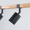 A close-up shot of a wooden beam with two black track lights attached. Podgląd zdjęcia produktu