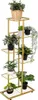 A multi-tiered metal plant stand filled with various artificial plants. Náhľad obrázku produktu