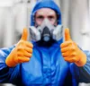 A person wearing a blue hazmat suit and orange gloves gives a thumbs up. Náhľad obrázku produktu