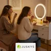 Two young women are applying makeup at a vanity table with a lighted mirror. Náhľad obrázku produktu