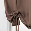 A close-up of a brown tie-up curtain. Náhled obrázku produktu