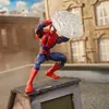 A Spider-Man action figure is posed on a rooftop, holding a web accessory. Podgląd zdjęcia produktu