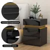 A modern black nightstand with LED lighting is displayed next to a bed. Close-ups highlight its glossy panels and drawers. Produktbild-Vorschau