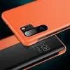 A close-up shot of an orange phone case with a transparent flip cover showing the phone's screen. Produktbild-Vorschau
