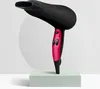 A black and pink hairdryer is displayed on a light green pedestal in front of a textured white circular backdrop. Produktbild-Vorschau