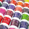 A collection of colorful tubs of La Riché Directions semi-permanent hair dye. Produktbild-Vorschau