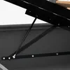 A close-up view of the gas spring mechanism and metal frame of a bed. Produktbild-Vorschau