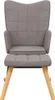 A front view of a gray fabric armchair with a matching ottoman and wooden legs, isolated on a white background. Produktbild-Vorschau