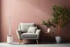 A modern living room with a chair, a plant, and a floor fan. Podgląd zdjęcia produktu