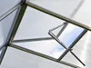 Interior view of a greenhouse roof with an open vent. Produktbild-Vorschau