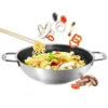 A wok filled with noodles and vegetables, with ingredients flying into it. Anteprima dell’immagine prodotto