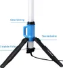 A close-up view of the base of a vertical LED work light, showing its tripod legs and central housing. Náhled obrázku produktu
