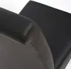 A close-up view of the armrest and seat of a black leather chair. Produktbild-Vorschau