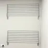 Two wall-mounted drying racks are shown on a plain white wall. Náhľad obrázku produktu
