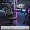 A gaming chair and desk setup in a bedroom with colorful LED lighting. Produktbild-Vorschau