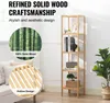 A tall, narrow bamboo shelf unit with items on it, next to a couch and a plant. There are callouts highlighting the wood and design. Podgląd zdjęcia produktu