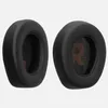 Two black ear pads for headphones are shown against a white background. Produktbild-Vorschau