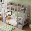 A child's loft bed with a sofa underneath, set up in a room with light green walls and a wooden floor. Náhled obrázku produktu