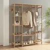 A wooden garment rack with shelves, displaying clothes, hats, and shoes. Anteprima dell’immagine prodotto