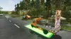 A truck with a construction sign is on a road next to trees. Produktbild-Vorschau