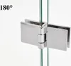 A close-up shot of a glass hinge for a shower door, mounted between two glass panels. Podgląd zdjęcia produktu