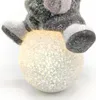 Winterkind Mädchen auf LED Schneeball 19cm Dekofigur Produktbild-Vorschau 2