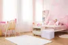 A child's bedroom with a bed, desk, chair, and storage. Voir les images du produit