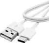A white USB-C to USB-A charging cable coiled on a white background. Náhľad obrázku produktu