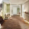 A hallway with a staircase, bench, and decorative elements. Produktbild-Vorschau