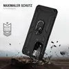 A black phone case with a ring holder is shown in a dynamic, action-oriented scene, suggesting durability and protection. It appears to be falling or being dropped onto rocks, with debris flying around it. Produktbild-Vorschau