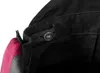 A close-up view of the inside of a pair of black work overalls, showing an adjustable elastic waistband with a button. Náhled obrázku produktu