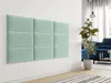 A wall decorated with mint green upholstered panels in a modern living room setting. Náhľad obrázku produktu