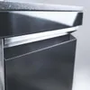A close-up view of the corner of a black and silver outdoor kitchen unit. Náhled obrázku produktu
