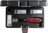 A black plastic case containing a set of tools, including a screwdriver with a red and black handle. Podgląd zdjęcia produktu