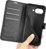 A hand holding open a black leather wallet-style phone case, revealing the interior card slots and the phone holder. Produktbild-Vorschau